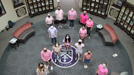 SHC Students wearing pink shirts stand in the shape of the cancer ribbon.  (photo: Stuart Babington)