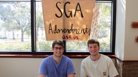 SGA members Ryan Ankerson and Adam Schmitt sit at the back of the student center to answer questions. (photo: Kate Huete)