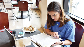 SHC student Carmen Smith studies in the Barter Student Center. (photo: Emily Creasey)
