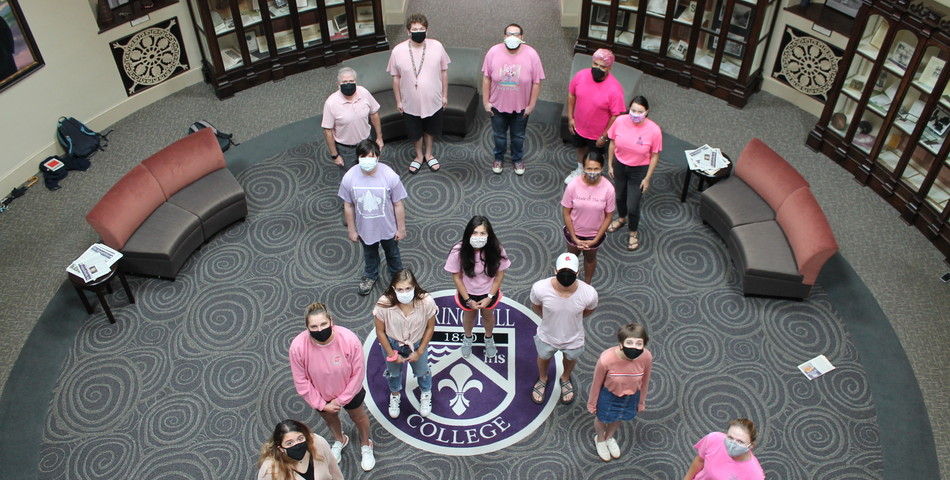 Stuart Babington: SHC Students wearing pink shirts stand in the shape of the cancer ribbon. 