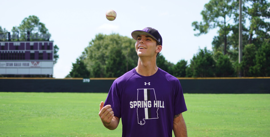 Kayley Robinson: Pitcher Christian Long tosses a baseball before practice.