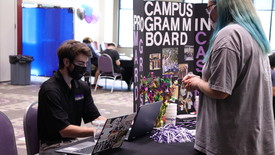 Aaron Foster talks about the Campus Programming Board at Badger Expo. (photo: BessMorgan Baluyut)