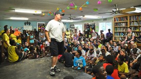 John Eads talks to youths at his Light of the Village facility. (photo: )