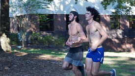 SHC's cross country team members David Toupes, left, and Spencer Albright, right, run the hill during a recent practice. (photo: Ben Breymier)