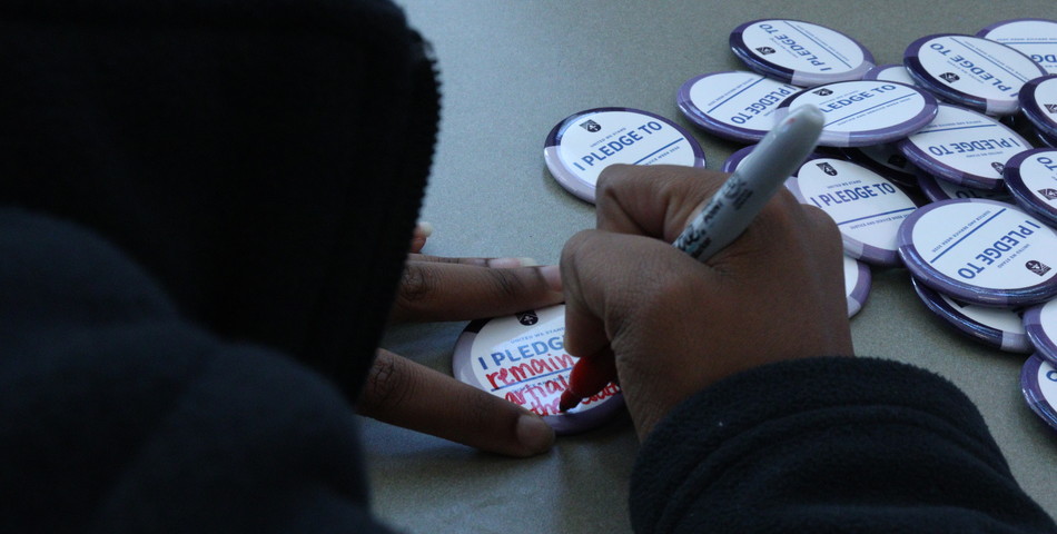 : Student makes her personal pledge to justice service in the cafeteria.