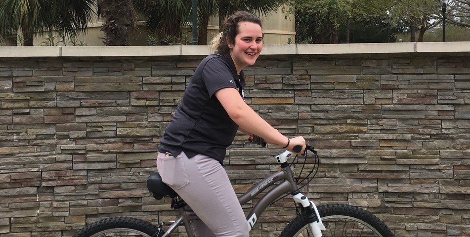 Caroline Weishaar: Sophomore Betsy Blumenfeld rides the bicycle she won in the raffle.