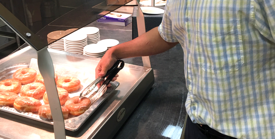 Rebecca Bankston: Junior Tempel Viti checks out the fresh donuts in the cafeteria.