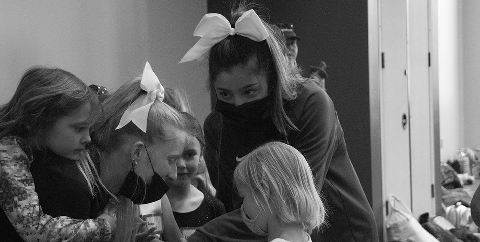 India Hall : Gabby Rocha and other team members teaching children about cheer and dance